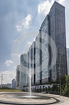 High modern skyscrapers behind a fountain photo