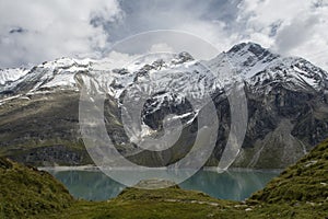 High mountain glacier over the lake