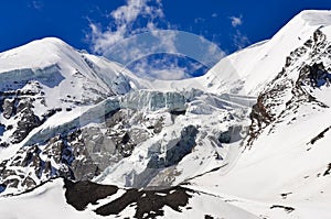 High mountain glacier and snow peaks and slopes