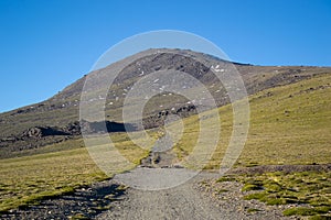 High mountain landscape called Alto del Chorrillo in Sierra Nevada with roads going up to Mulhacen photo