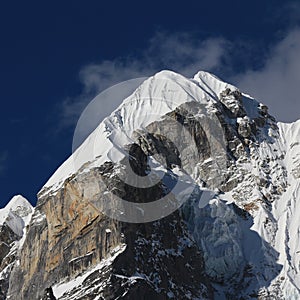 High mountain Lobuche West covered by glacier