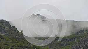 High mountain surrounded by myst photo