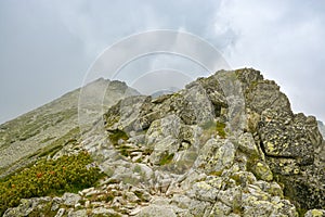 High mountain trail towards Slavkovsky peak in High Tatras mountain in northern part of Slovakia