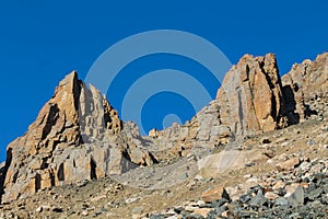 High mountain wall of Tian Shan peaks in Tuyuk Su panorama landscape