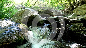 High mountain water going down the river