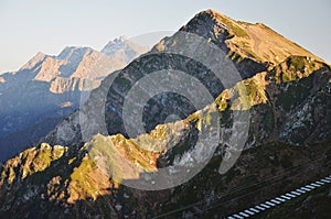 High mountains in the rays of the setting sun