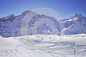 High mountains under snow in the winter. Slope on the skiing resort, European Alps