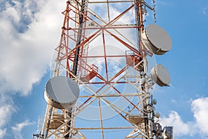 High network telecommunication tower with satellite dishes