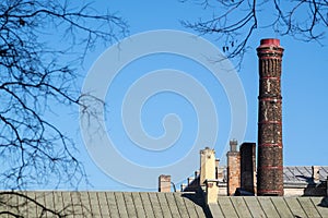 High old flue against the blue sky