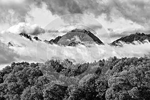 High peaks in the clouds. Black and white photography