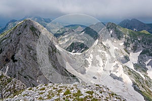 High peaks in limestone mountains in clouds