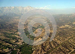 High Peaks Rise Above the Haze Near Pakistan photo