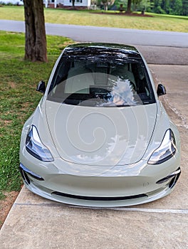 high performance sporty electric vehicle parked in a driveway