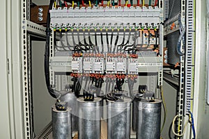 High-power capacitors installed in the electric box. Powerful electrical switches.