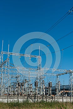 High power electricity poles in urban area. Energy electricity transmission, high voltage supply. Power Lines