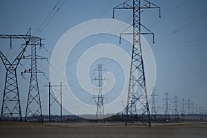 high power transmission lines with workers doing maintenance photo