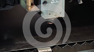 High precision CNC laser cutting metal sheet. Clip. Laser cutting in printing. Modern industrial technology
