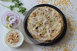 A high protein Indian flat bread with whole wheat and lentils. Popularly known as moong dal paratha in many parts of India