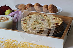 A high protein Indian flat bread with whole wheat and lentils. Popularly known as moong dal paratha in many parts of India. Served
