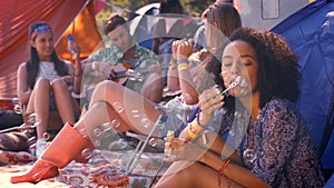 In high quality format carefree hipster blowing bubbles in tent