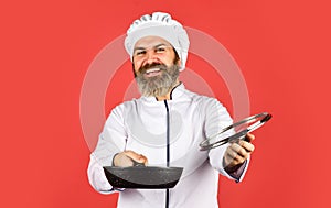 High quality frying pan. Bearded man cook white uniform. Homemade breakfast. Cooking like pro. Easy tasty meal prepared