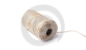 High-quality handmade coil made of natural hemp rope, isolated on a white background