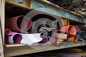 High quality multicolored dyed leather on shelves.