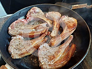 High quality top and lamp chops cooked in an ironcast pan