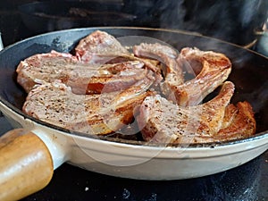 High quality top and lamp chops cooked in an ironcast pan