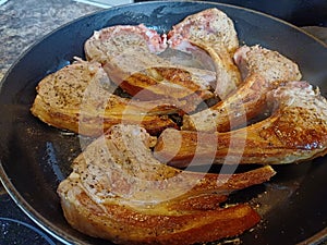 High quality top and lamp chops cooked in an ironcast pan