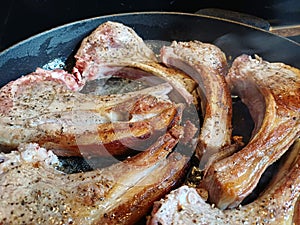 High quality top and lamp chops cooked in an ironcast pan