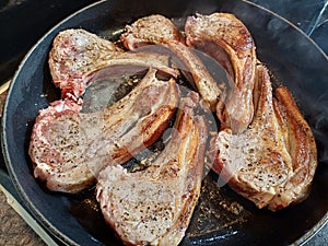 High quality top and lamp chops cooked in an ironcast pan