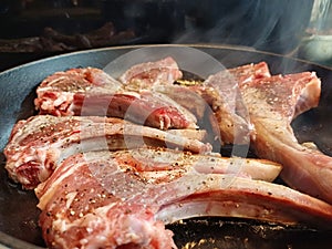 High quality top and lamp chops cooked in an ironcast pan