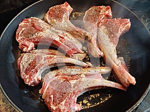 High quality top and lamp chops cooked in an ironcast pan