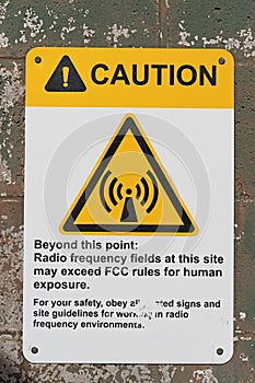 High Radio Frequency Fields Warning Sign On Block Wall photo