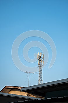 high radio tower against blue sky