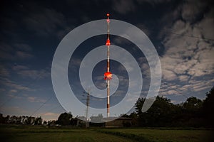 High radio tower at night