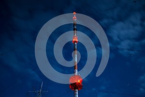 High radio tower at night