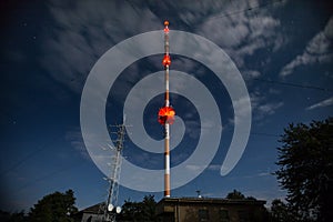 High radio tower at night