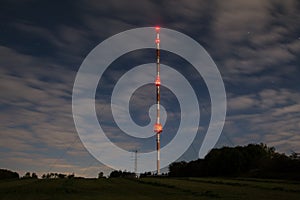 High radio tower at night