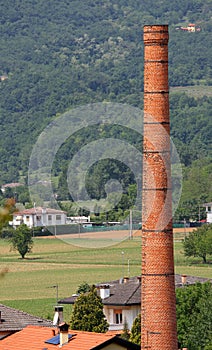 High red brick smokestack of an old factory