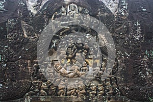 High relief sandstone carvings depicting monkeys in the story of the Ramayana at Angkor Wat Siem Reap Temple