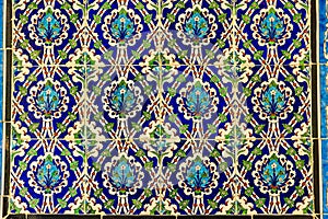 high res historical vibrant colorful shining floral and arabesque tiled wall in Cairo photo