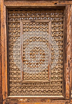 High res intricate arabesque intense inlaid wood window decorated wall in Cairo, Egypt photo
