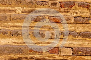 high res of a pale, smooth multi earth tone horizontal brick and wood wall in Egypt photo