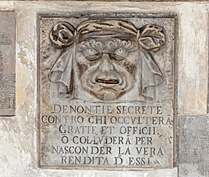 High res weathered famous historical mouth of truth Denounce your neighbors stone sculpture photo