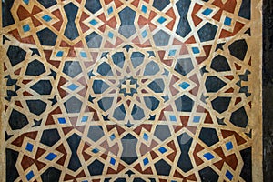 High Res weathered pale multi color mosaic arabesque design wall close up from Egypt photo