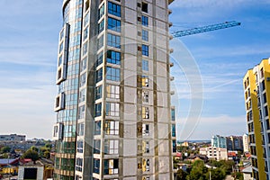 High residential apartment building under construction. Real estate development