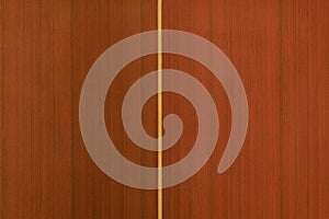 This high-resolution background texture captures the detailed grain of a vertical orange-stained wood surface, ideal for modern