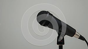Close-Up of a Modern Black Microphone on a Stand